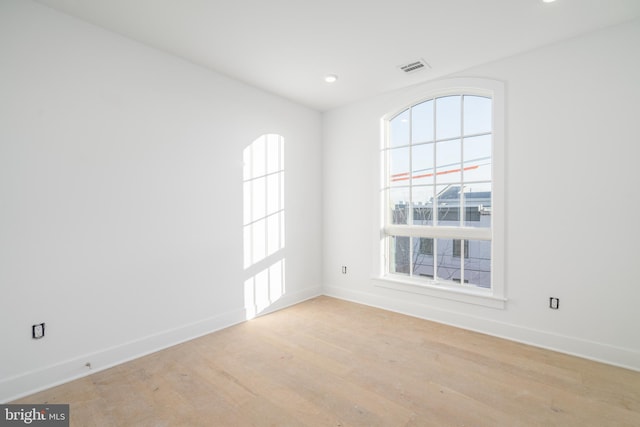 spare room with light hardwood / wood-style floors