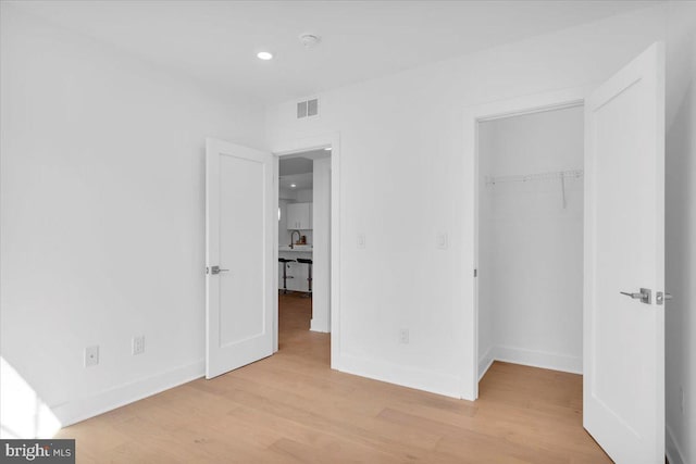 unfurnished bedroom with light hardwood / wood-style flooring