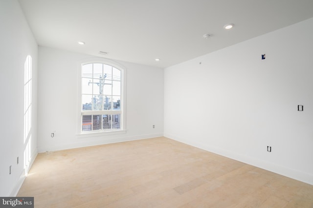 spare room featuring light wood-type flooring