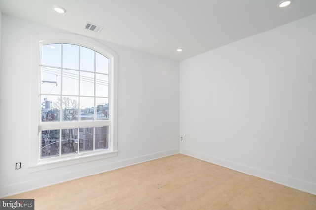 unfurnished room featuring light hardwood / wood-style floors