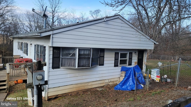 bungalow-style house featuring a wooden deck