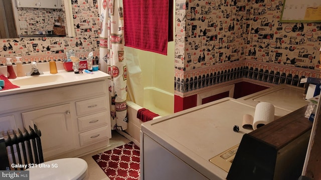 full bathroom with tile floors, toilet, vanity, and shower / bath combo with shower curtain