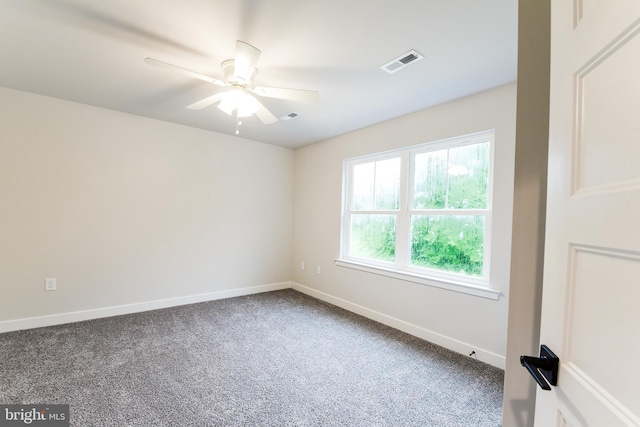 carpeted empty room featuring ceiling fan