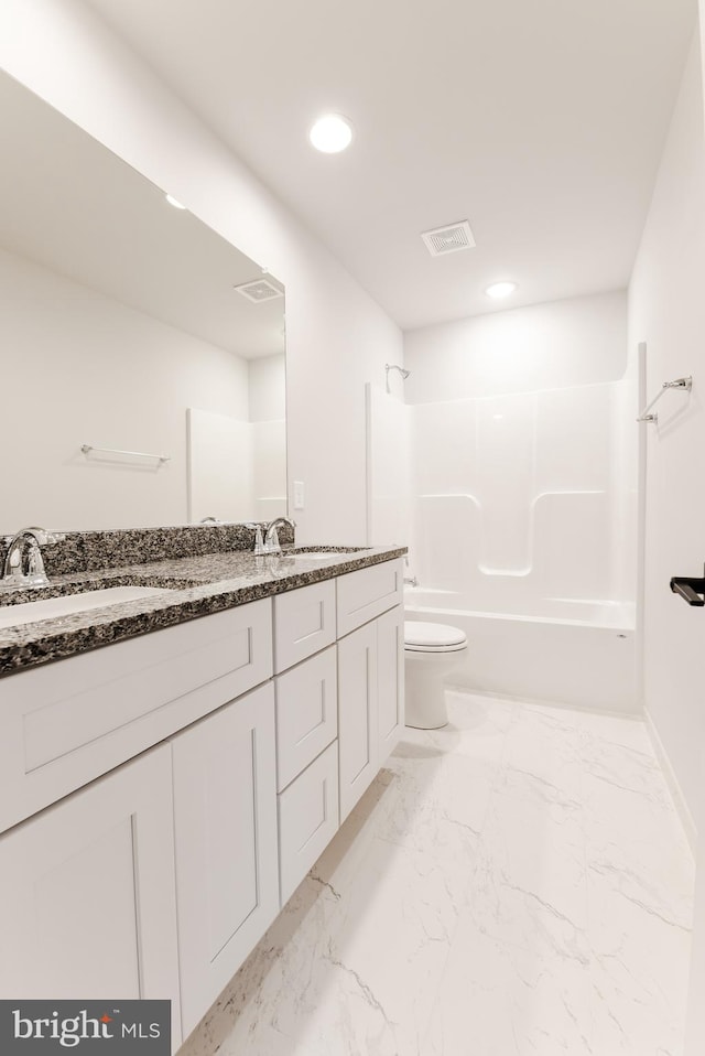 full bathroom featuring toilet, bathing tub / shower combination, large vanity, and tile flooring