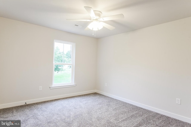 unfurnished room with light carpet and ceiling fan