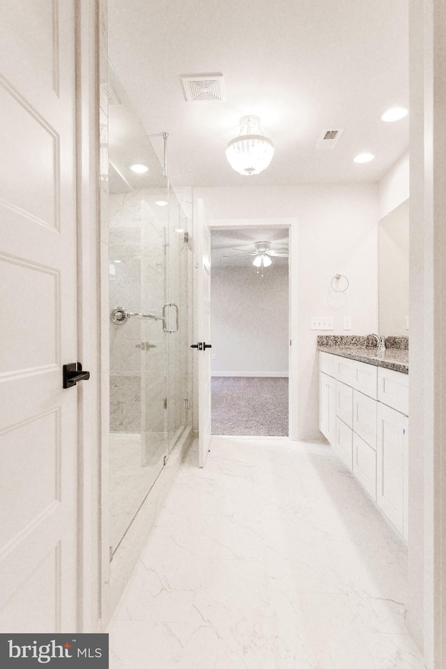 bathroom with ceiling fan, tile floors, vanity, and an enclosed shower