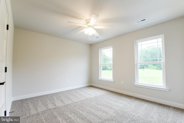 carpeted empty room with ceiling fan