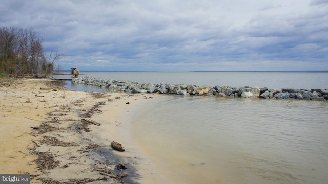 property view of water featuring a beach view