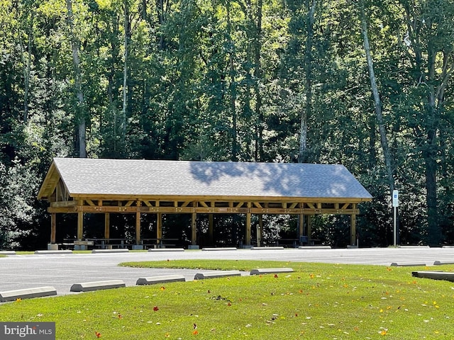 surrounding community with a gazebo and a lawn