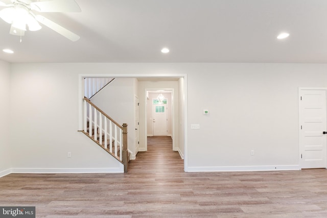 empty room featuring ceiling fan and light wood-type flooring