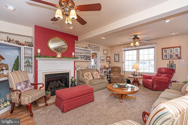 living room featuring ceiling fan and light hardwood / wood-style floors