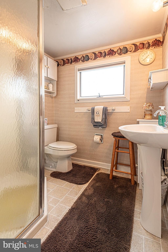 bathroom featuring walk in shower, ornamental molding, tile floors, and toilet