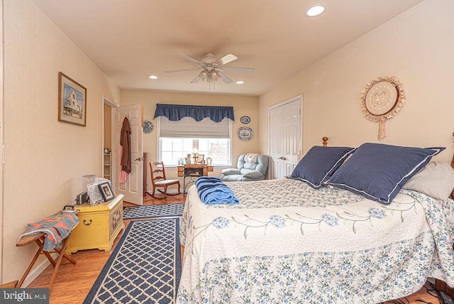 bedroom featuring a closet, ceiling fan, and light wood-type flooring