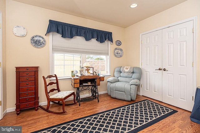 sitting room featuring light hardwood / wood-style flooring