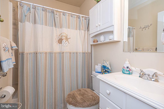 bathroom featuring large vanity and toilet