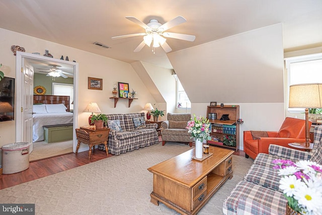 living room with ceiling fan and hardwood / wood-style flooring