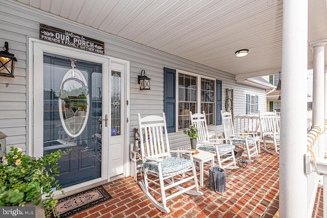 property entrance with covered porch