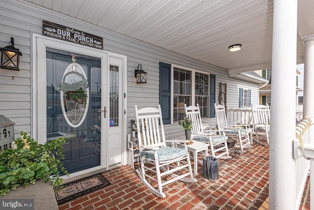 view of exterior entry with covered porch