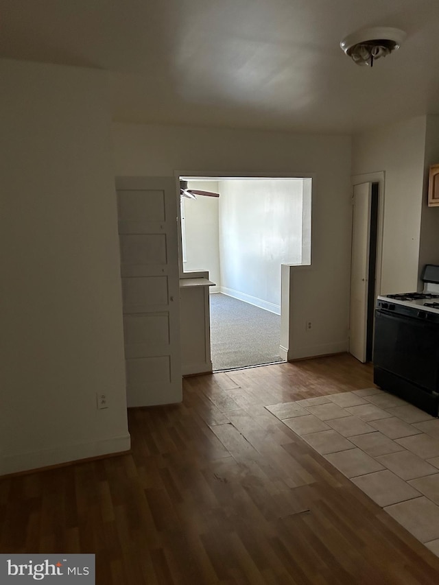 unfurnished room featuring ceiling fan and light wood-type flooring