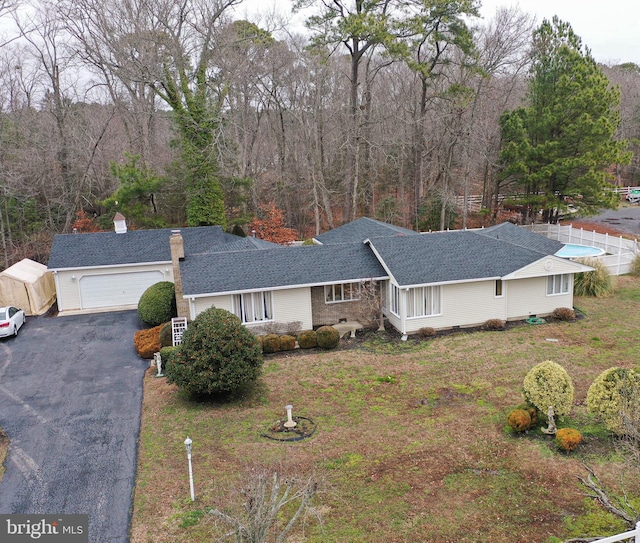 4421 Beechwood Pl, Crisfield, MD 21817 - ranch-style house featuring a garage and a front yard