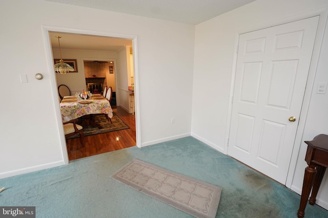 interior space featuring a fireplace and brick wall