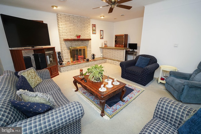 living room featuring ceiling fan, a fireplace, a textured ceiling, brick wall, and carpet flooring