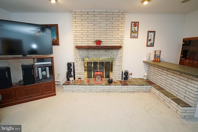 carpeted living room with brick wall, a brick fireplace, and a textured ceiling