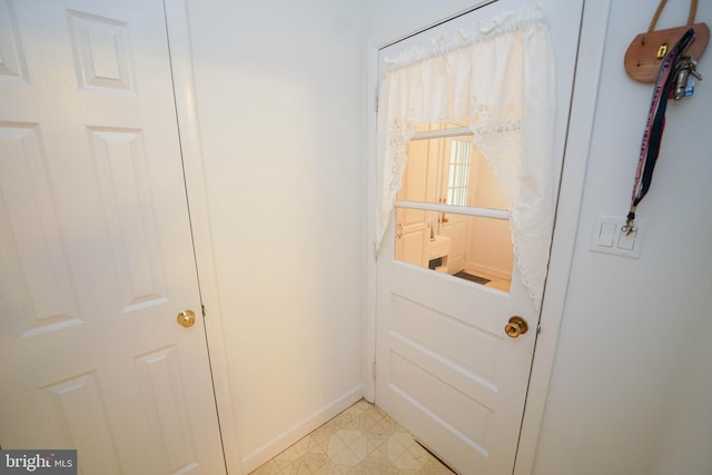 entryway with light tile flooring