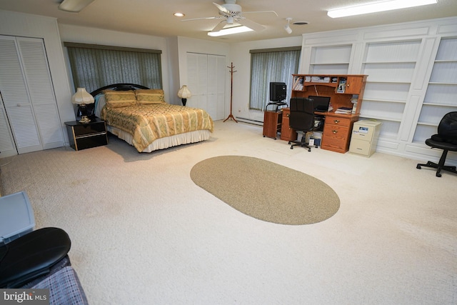 bedroom with carpet flooring, ceiling fan, and a baseboard radiator