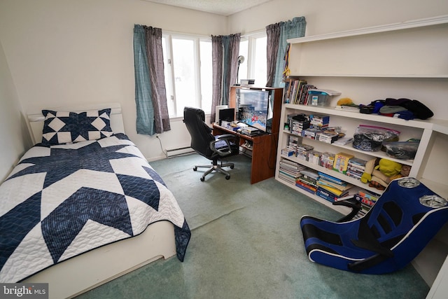 bedroom with carpet and a baseboard radiator