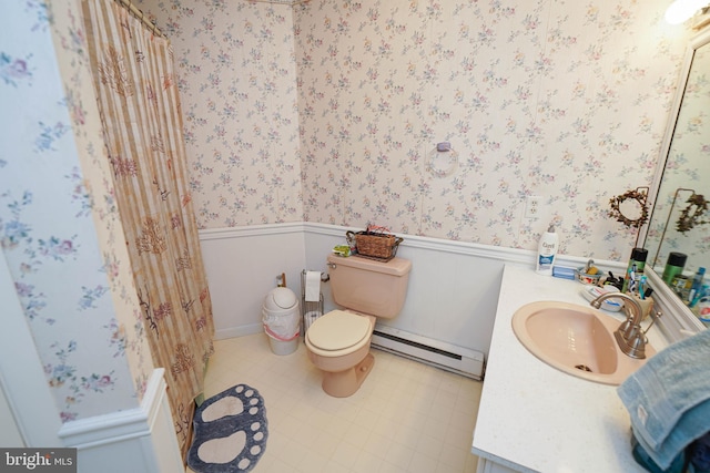 bathroom with toilet, tile floors, vanity, and a baseboard radiator