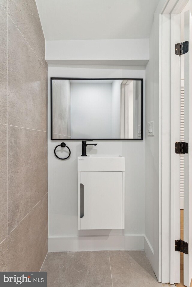 interior space featuring tile patterned floors and vanity