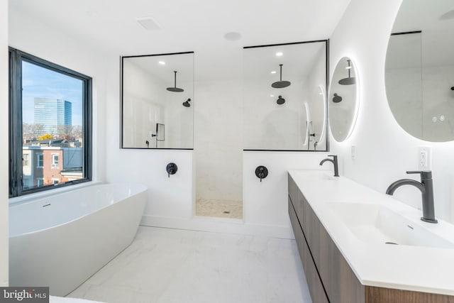 bathroom with separate shower and tub, double sink vanity, plenty of natural light, and tile patterned flooring