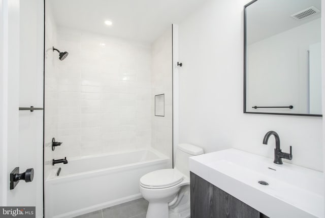 full bathroom with vanity, tiled shower / bath, tile patterned flooring, and toilet