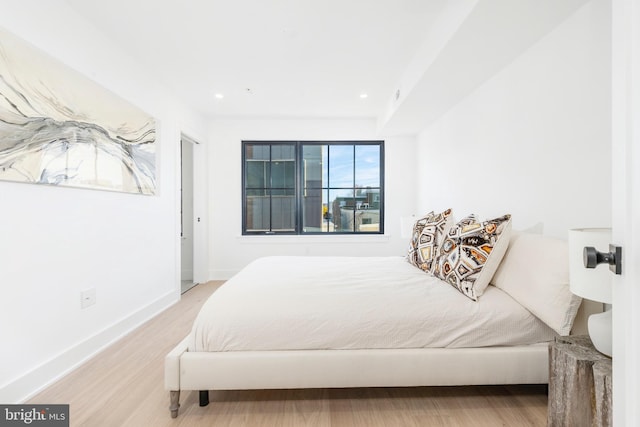 bedroom with wood-type flooring