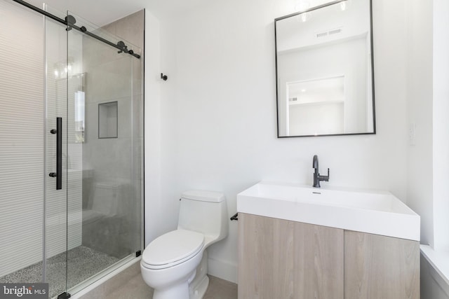 bathroom featuring walk in shower, vanity, and toilet