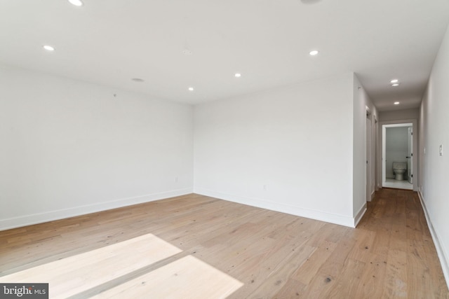 spare room with light wood-type flooring