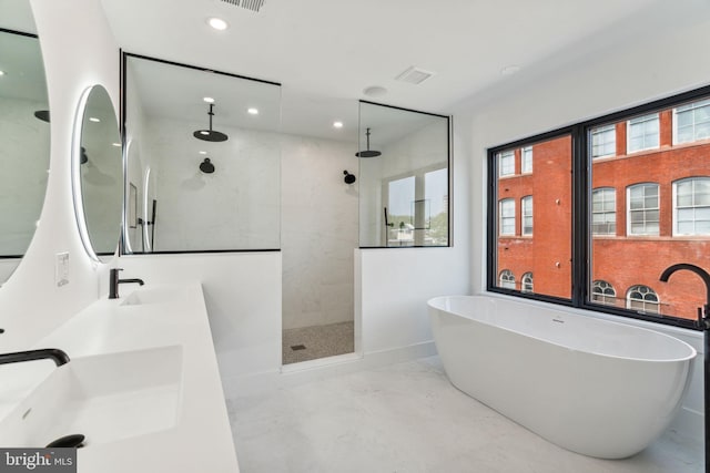 bathroom with independent shower and bath and double vanity