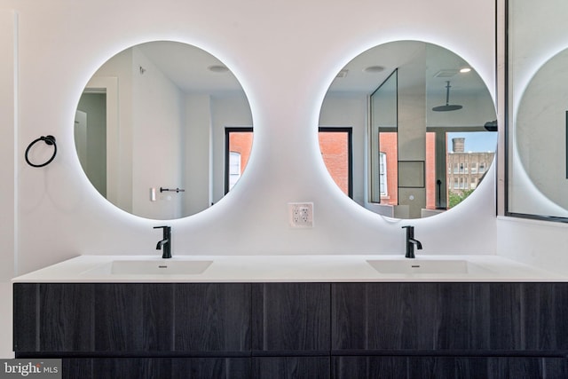 bathroom with a wealth of natural light and double vanity