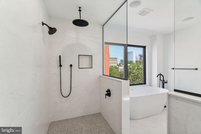 bathroom featuring a tile shower