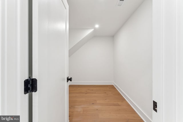 bonus room with light hardwood / wood-style floors