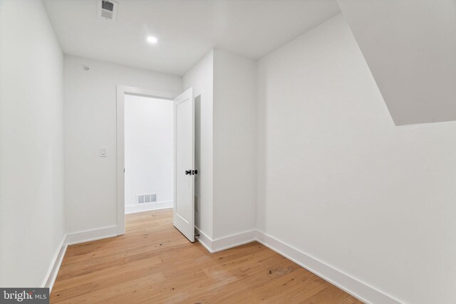 bonus room with light wood-type flooring