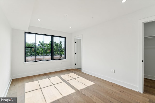 unfurnished bedroom with light wood-type flooring