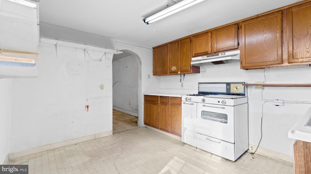 kitchen with white gas range oven