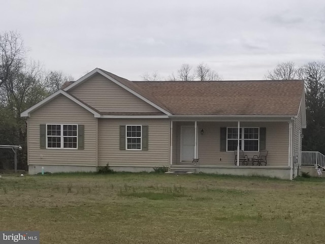 view of front of house featuring a porch and a front lawn