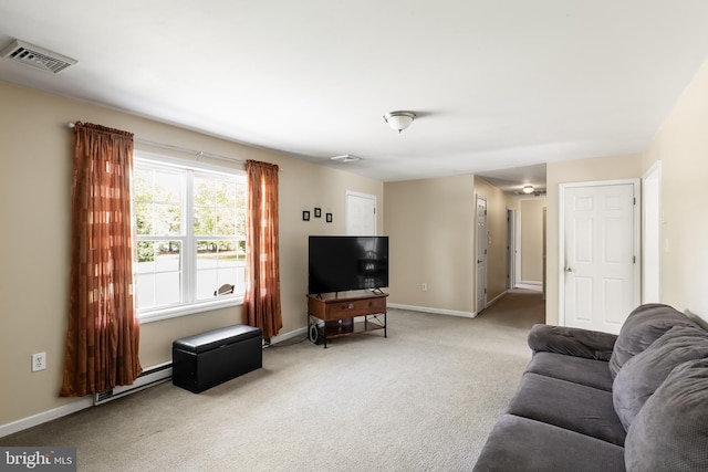 carpeted living room with baseboard heating