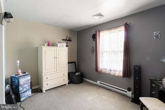 bedroom featuring carpet and a baseboard heating unit