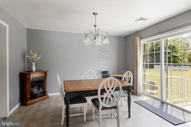 dining space featuring a chandelier