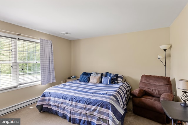 carpeted bedroom with a baseboard radiator