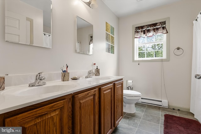 bathroom featuring tile patterned floors, vanity, toilet, and a baseboard heating unit